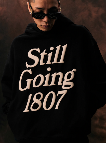 1807 STILL GOING Foam Print Hoodie